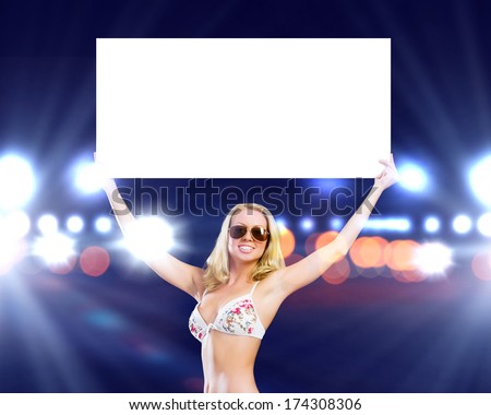 Attractive girl in swimming suit holding white blank banner above head