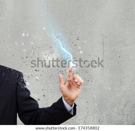 Close up of human hand with flash of lightning