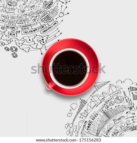Cup of coffee with sketches at background
