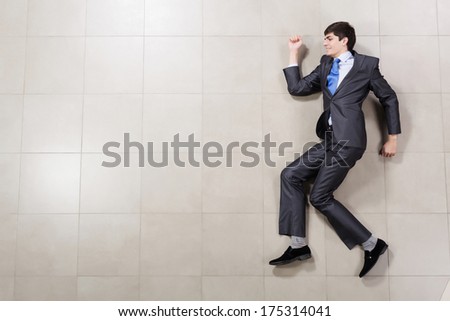 Funny image of young handsome running businessman