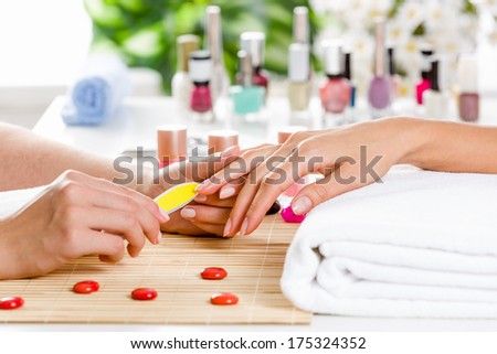 Close up of process of manicure at beauty salon