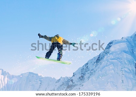 Man on snowboard jumping in sky. Summer vacation