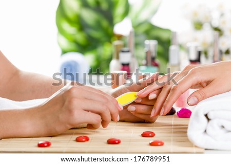 Close up of process of manicure at beauty salon