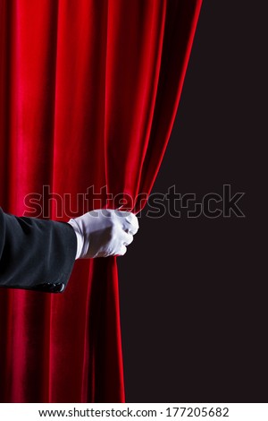 Close up of hand in white glove open the curtain. Place for text