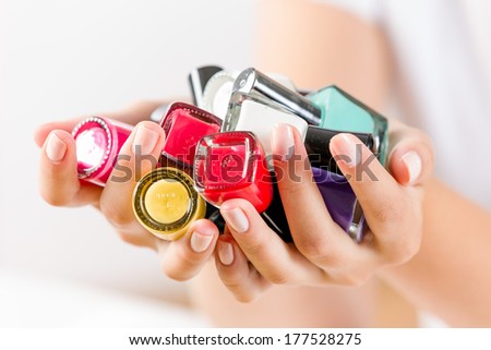 Close up of woman hands with nail polishes