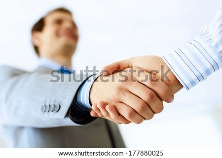 Close Up Image Of Business Handshake At Meeting. Partnership Concept