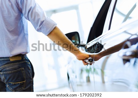 Close up human hand opening car door Close up human hand opening car door