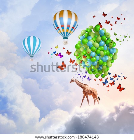 Giraffe flying high in sky on bunch of colorful balloons