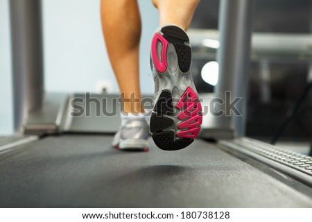Image of female foot running on treadmill