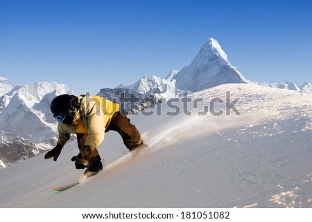 Snowboarder making jump high in clear sky