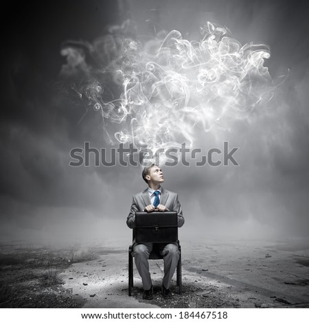Young businessman thinking over the ideas. Creativity concept