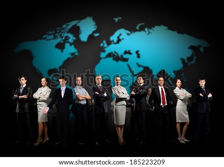 Group of businesspeople standing together against a world map background