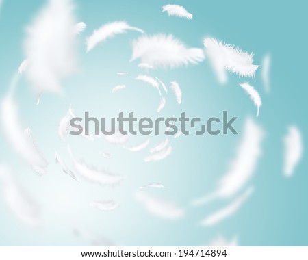 Abstract background image of white feathers flying in air