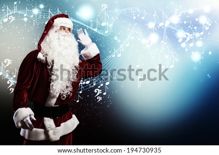 Santa Claus enjoying the sound of music