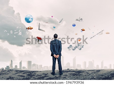 Back view of confident businessman dreaming about future