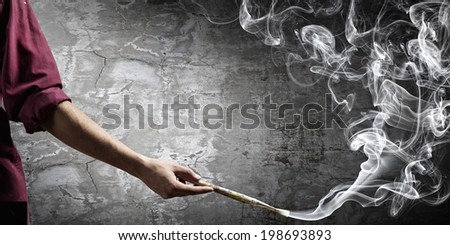 Young handsome man painter with brush in hand