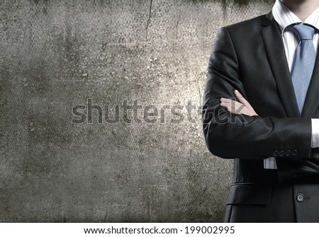 Close up of businessman with arms crossed on chest