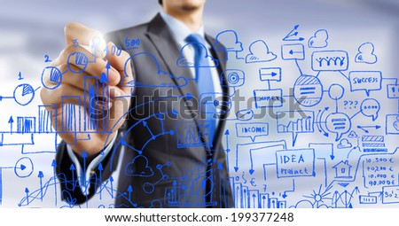 Close up of businessman drawing business sketches with marker