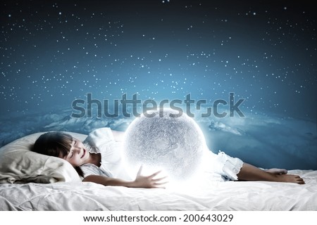 Cute girl sleeping in bed with moon