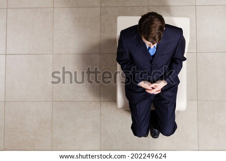 Top view of businessman sitting on chair