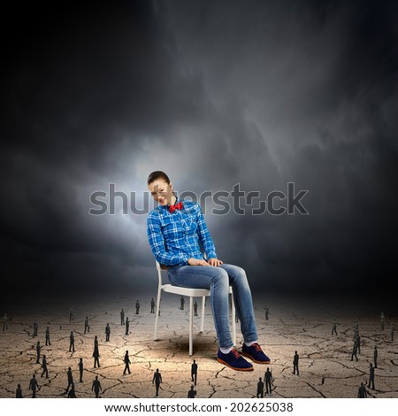 Woman in casual sitting on chair and many small silhouettes of businesspeople around