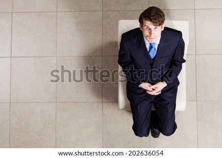 Top view of businessman sitting on chair