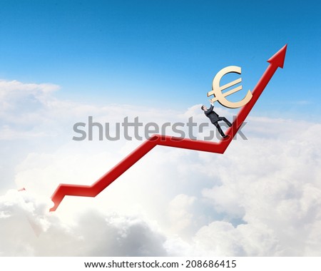 Businessman rolling euro sign up the graph