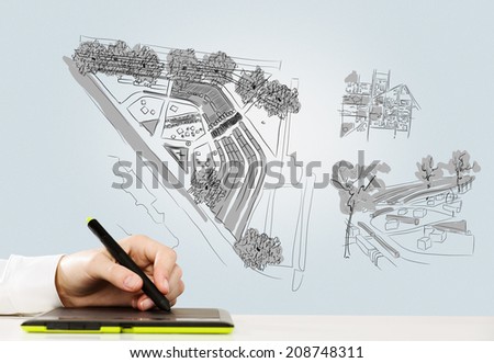 Close up of man hand drawing construction sketches