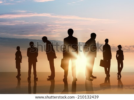 Silhouettes of business people standing in line