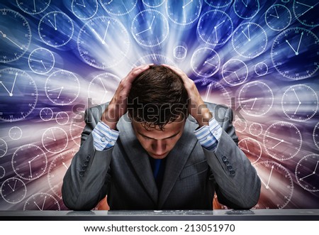 Troubled thoughtful businessman with hands on head