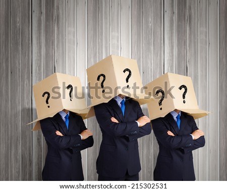 Businessman with box on head expressing emotions