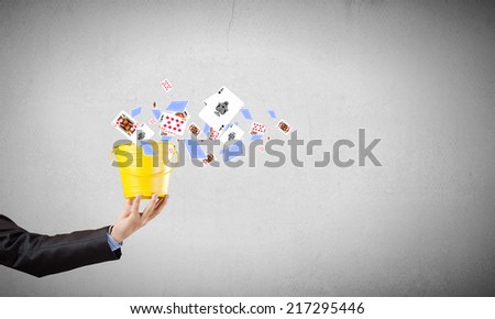 Close up of businessman hand holding yellow bucket in hand