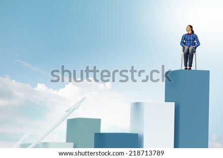 Young woman sitting on chair on graph bars