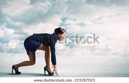 Side view of businesswoman standing in start position