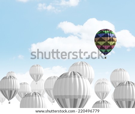 Conceptual image with balloons flying high in sky