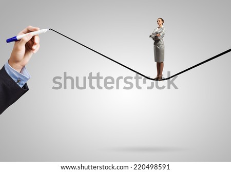 Young confident businesswoman standing on drawn line