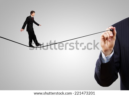 Businessman walking on drawn line. Risk concept