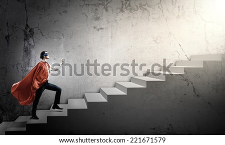 Young man walking up the stair case
