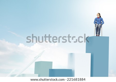 Young woman sitting on chair on graph bars