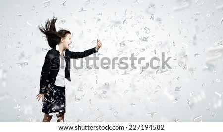 Young businesswoman screaming with rage in mobile phone