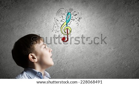 Cute boy of school age and music symbol