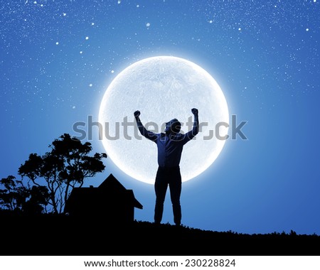 Silhouette of screaming man celebrating success