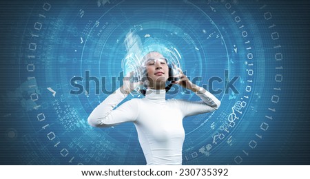 Young woman in white wearing headphones. High-tech concept