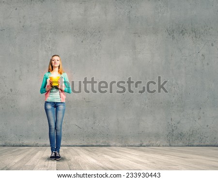 Young woman in casual with yellow bucket in hands