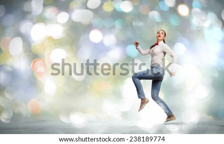 Young woman in casual running in a hurry