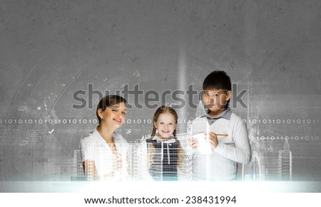 Young teacher and her pupils doing tests lesson