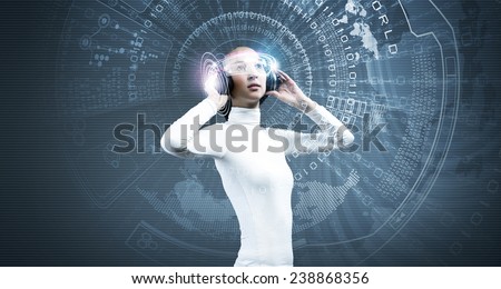 Young woman in white wearing headphones. High-tech concept