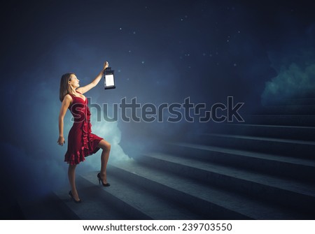 Young girl in red dress walking on stair case