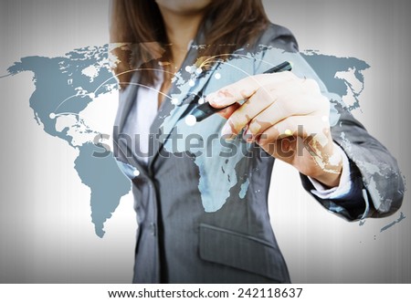Close up of businesswoman drawing world map with pen