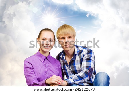 Young happy couple hugging each other tenderly